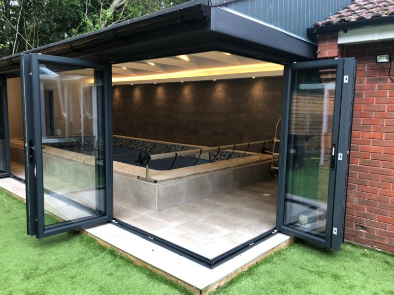 Bifold Doors On A Corner. Swimming Pool Entrance